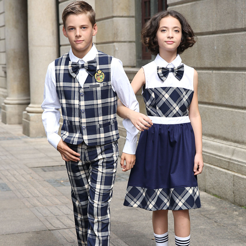 Los uniformes escolares venden al por mayor el delantal modificado para requisitos particulares de la escuela del muchacho y de las muchachas del patrón de la tela escocesa